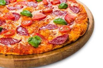 Delicious pizza with pepperoni and tomatoes