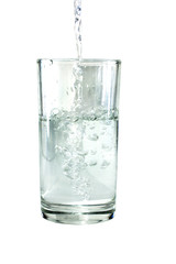 Empty water poured into a glass of water.