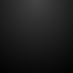 Dark striped zig zag texture. Black carbon background..