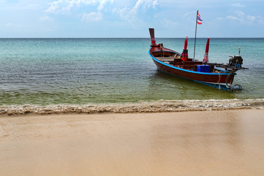 Thai traditional boat on the beach on the roads