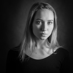 Black and white portrait of a beautiful young woman.