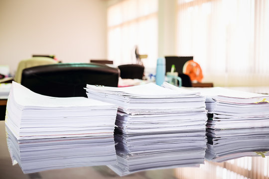 Close up Pile of unfinished business documents on office desk, Stack of business paper.select focus