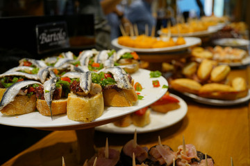 Spanish fingerfood and tapas set on bar counter