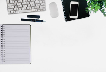 Office desk table with computer, supplies,analysis chart, ipad,smartphone,coffee cup on wooden background. Top view with copy space