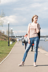 Girl with blond hair on the promenade