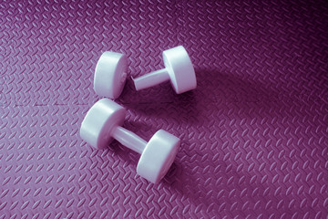 broken dumbbell and on black background