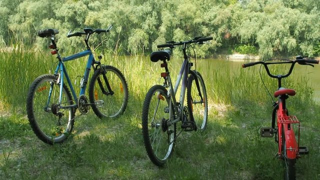 Bicycles on the river bank. Three bicycles on the river bank.