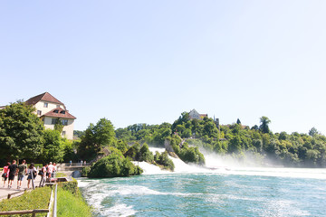 Fototapeta na wymiar The Rhine Falls in Schaffhausen, Switzerland. - May ‎27, ‎2017 : The Rhine Falls in Schaffhausen. During the high season of Switzerland, so many tourists travel a lot. To find the beauty.