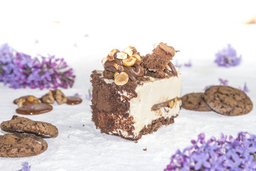 Beautiful piece of cake, cookies and caramel with nuts