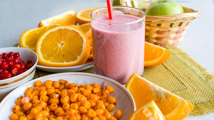 Berry cocktail and oranges on the table