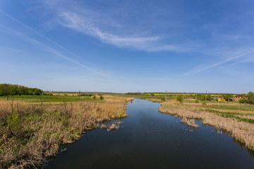 green grass with a river on background