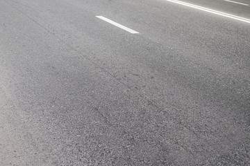 Background. Texture of asphalt with a marking on the whole frame. Horizontal frame