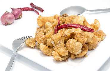 Pork snack, pork rind isolated on white background.