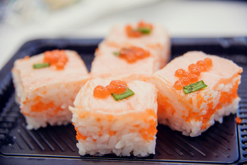 Fresh and delicious maki and nigiri sushi and sake glass.