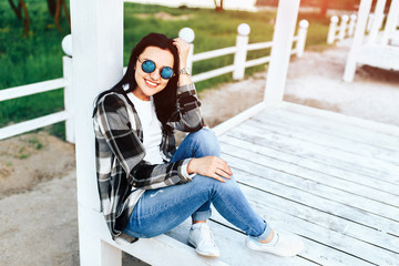 Pretty brunette girl with beautiful smile relaxing outdoor