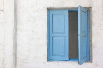 Obraz na płótnie Canvas Slightly open of blue wooden window