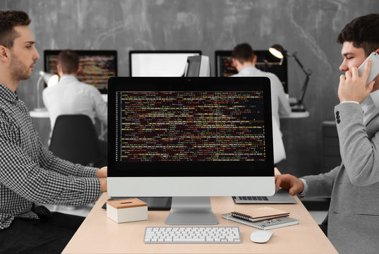 Web site codes on computer monitor in office