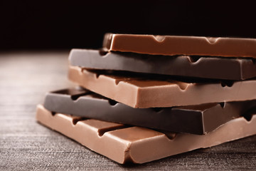 Chocolate bars on wooden table