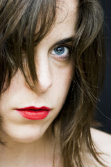 Portrait of a beautiful Blue-eyed woman on black background