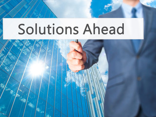 Solutions Ahead - Businessman hand holding sign