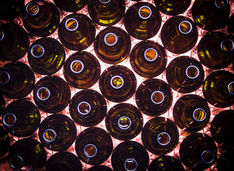 Circular rows of brown color bottles