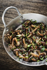 fried shiitake mushrooms in garlic herb and olive oil snack