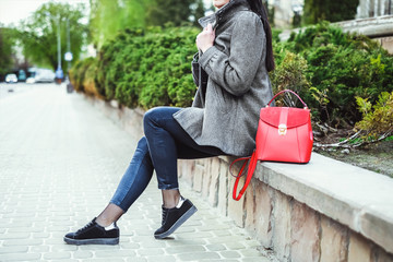 Woman on the street with red backpack