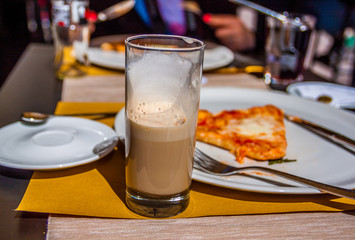 fresh warm pizza and table on street in italy 