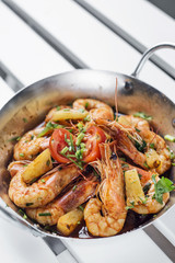 stir fry prawns in spicy asian pineapple and herbs sauce