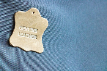 Genuine leather label, isolated on a copy space background