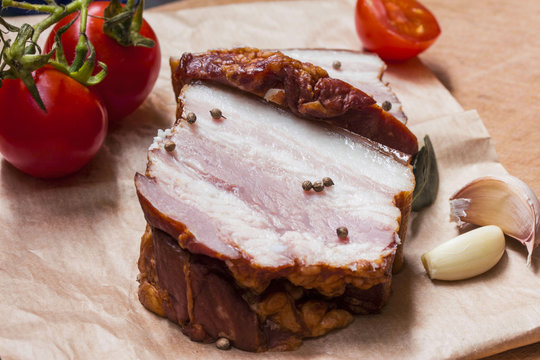 Pieces of juicy smoked boiled pork on the table