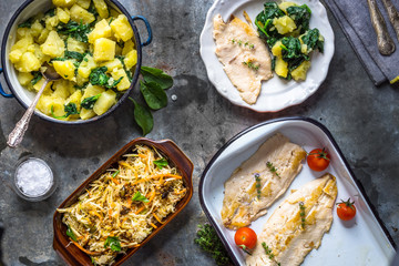 Griled fish fillet with potato and salad
