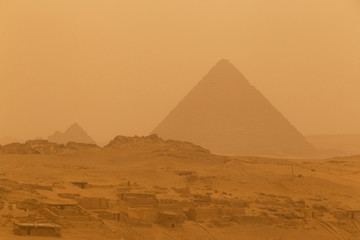 view on Menkaure pyramid in Giza at sandy storm