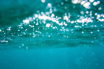 Water bubbles in underwater in blue ocean. Water texture.