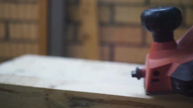 A special electric lathe removes from the wood a non-treated layer, the sawdust flies aside. SLOW MOTION. 1920x1080.
