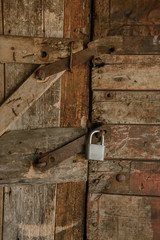 Old locked wooden door with a lock