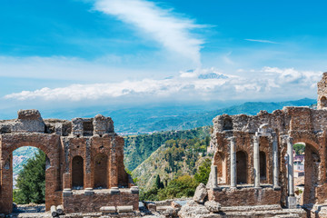 Greek theater in Taormina with Etna volcano Sicily - obrazy, fototapety, plakaty