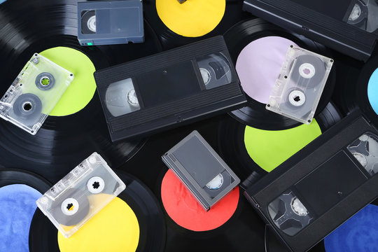 Vinyl records with video and music cassette tapes
