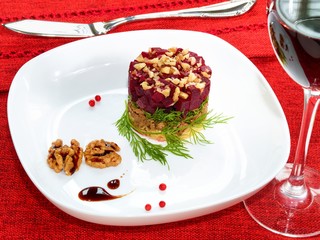 Beet and meat salad with nuts and cheese