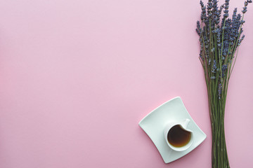 Flat lay of lavender background and coffee on pink background