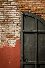 Brick Wall with an Open Door