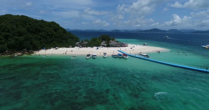 Aerial view of tropical island Koh Khai Nai and sea with moored yachts