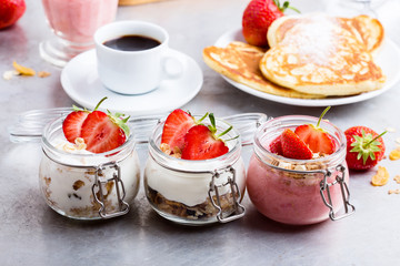 Healthy breakfast with natural greek yogurt, muesli and berries