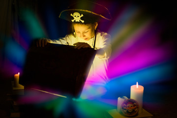 Adventurous girl found a treasures. Happy young pirate.