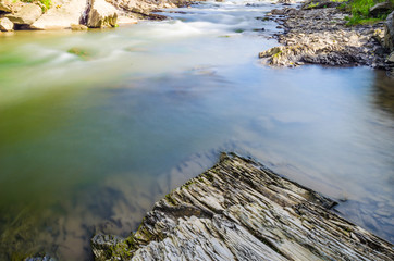 Background of Carpathian mountain river with long exposure