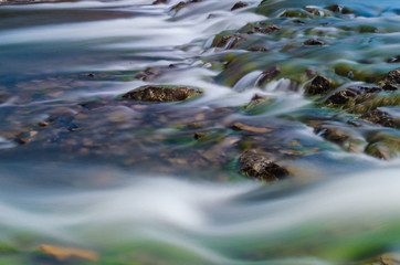 Background of Carpathian mountain river with long exposure