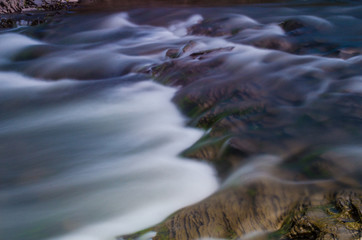 Background of Carpathian mountain river with long exposure