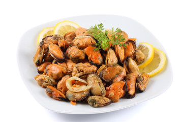 marinated mussels in white plate isolated on white background