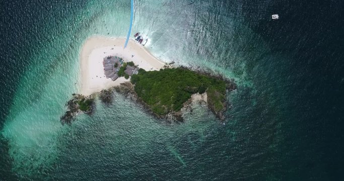 Aerial top view of tropical island Koh Khai Nai and sea with moored yachts
