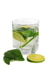 Cold mojito drink, glass of alcohol isolated over white background, fresh mint and lime fruit slice, food still life, party and holidays celebration